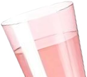 Tilted transparent plastic cup containing pink liquid against white background.